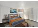 Spacious bedroom featuring ample closet space and comfortable furnishings at 4010 Grove St, Denver, CO 80211