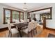 Elegant dining room featuring hardwood floors, natural light, and space for entertaining at 4010 Grove St, Denver, CO 80211
