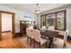 Inviting dining room featuring hardwood floors, ample seating, and natural light at 4010 Grove St, Denver, CO 80211