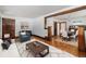 Inviting living room featuring hardwood floors, bright white walls, and comfortable seating at 4010 Grove St, Denver, CO 80211