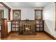Inviting living room featuring a brick fireplace with brass fixtures and hardwood floors at 4010 Grove St, Denver, CO 80211