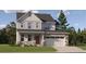 Charming two-story home with stone accents, a two-car garage, and a well-manicured front lawn at 10792 Snowdon St, Parker, CO 80134