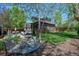 Lush backyard with a well-maintained lawn and a quaint outdoor seating area at 1027 S University Blvd, Denver, CO 80209