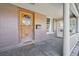 Inviting front porch with charming details and a classic welcome mat at 1027 S University Blvd, Denver, CO 80209