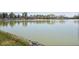 A tranquil view of a lake surrounded by lush greenery and trees along the shoreline at 1027 S University Blvd, Denver, CO 80209