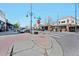 Commercial district shopping area with retail and cross walk surrounded by street lamps at 1027 S University Blvd, Denver, CO 80209