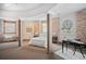 Large bedroom with exposed brick, curved ceiling, and unique architectural details at 3249 W Fairview Pl # 106, Denver, CO 80211