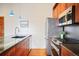 Well-equipped kitchen featuring stainless steel appliances, ample counter space, and modern fixtures at 3249 W Fairview Pl # 106, Denver, CO 80211