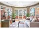 Inviting living room with a cozy seating area, large windows, and hardwood floors throughout the space at 3249 W Fairview Pl # 106, Denver, CO 80211