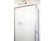 Modern shower with frosted glass door and brushed nickel shower head and handle at 3249 W Fairview Pl # 106, Denver, CO 80211