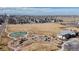 Aerial view of community park, playground, and open space in residential area at 4523 Crestone Peak St, Brighton, CO 80601