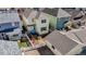 Aerial view of a home with a small deck in its fenced backyard, near the detached garage at 4523 Crestone Peak St, Brighton, CO 80601