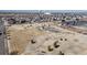 Aerial view of the community park with a playground, walking paths, and landscaping at 4523 Crestone Peak St, Brighton, CO 80601