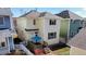 Overhead view of the backyard showcasing a patio, privacy fence, and landscaping at 4523 Crestone Peak St, Brighton, CO 80601