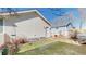 Well-maintained backyard with a detached garage and storage shed at 4523 Crestone Peak St, Brighton, CO 80601