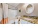 This bathroom features a granite countertop, modern fixtures, and a shower and tub combo at 4523 Crestone Peak St, Brighton, CO 80601