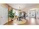 Cozy dining area featuring a round table, jute rug, pendant lighting, and large windows at 4523 Crestone Peak St, Brighton, CO 80601