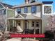 Charming home features a welcoming front porch and neutral exterior paint at 4523 Crestone Peak St, Brighton, CO 80601