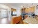 Well-lit kitchen with granite countertops, stainless steel appliances, and ample cabinet space at 4523 Crestone Peak St, Brighton, CO 80601