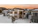 Aerial view of house at sunset, snowy landscape at 5191 Copper Blush Ct, Castle Rock, CO 80108