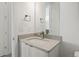 Clean bathroom with single vanity and a stylish mirror at 5191 Copper Blush Ct, Castle Rock, CO 80108