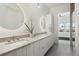 Modern bathroom with double vanity and a walk-in shower at 5191 Copper Blush Ct, Castle Rock, CO 80108