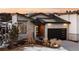 Modern home exterior with stone and large garage at 5191 Copper Blush Ct, Castle Rock, CO 80108