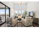 Living room with high ceilings, large windows, and comfortable seating at 5191 Copper Blush Ct, Castle Rock, CO 80108