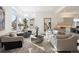 Bright and airy living room with large windows and comfortable seating at 5191 Copper Blush Ct, Castle Rock, CO 80108