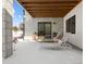 Covered patio with lounge chairs, snowy ground at 5191 Copper Blush Ct, Castle Rock, CO 80108