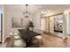 Dining room with a dark wood table, stylish chairs, and mirror at 3082 S Wheeling Way # 203, Aurora, CO 80014