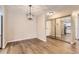 Open concept dining room featuring laminate floors and modern lighting at 3082 S Wheeling Way # 203, Aurora, CO 80014