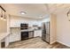 Modern kitchen with stainless steel appliances, granite countertops, and white cabinets at 3082 S Wheeling Way # 203, Aurora, CO 80014