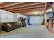 Spacious basement with carpet flooring, and exposed ceiling, awaits your personalization at 5837 High Timber Cir, Castle Rock, CO 80104
