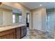 Bathroom showcasing a double vanity, a separate glass shower, and neutral wall color at 5837 High Timber Cir, Castle Rock, CO 80104