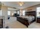 Bedroom boasts attached study, carpet, ceiling fan, and comfortable furniture; ideal for relaxation and work at 5837 High Timber Cir, Castle Rock, CO 80104