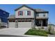 Charming two-story home with stone accents, a three-car garage and well-maintained landscaping at 5837 High Timber Cir, Castle Rock, CO 80104
