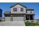 Charming two-story home with stone accents, a three-car garage and well-maintained landscaping at 5837 High Timber Cir, Castle Rock, CO 80104