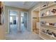 Bright hallway featuring neutral colors, plush carpeting, and decorative shelving at 5837 High Timber Cir, Castle Rock, CO 80104