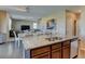 Open-concept kitchen with a large island flowing into the dining and living areas at 5837 High Timber Cir, Castle Rock, CO 80104