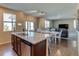Bright, open kitchen with granite countertops overlooks the dining area and the living room, creating an inclusive space at 5837 High Timber Cir, Castle Rock, CO 80104