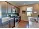 Well-equipped kitchen with granite countertops, stainless steel appliances, and ample cabinet space at 5837 High Timber Cir, Castle Rock, CO 80104