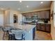 Spacious kitchen with a large island, granite countertops, and stainless steel appliances at 5837 High Timber Cir, Castle Rock, CO 80104