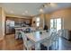Well-designed kitchen and dining area with stainless steel appliances, granite countertops, and hardwood flooring at 5837 High Timber Cir, Castle Rock, CO 80104