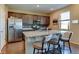 Modern kitchen featuring granite countertops, stainless steel appliances, and a functional island at 5837 High Timber Cir, Castle Rock, CO 80104