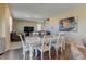 Spacious living area featuring comfortable seating, hardwood floors, and seamless flow to the dining area, perfect for gatherings at 5837 High Timber Cir, Castle Rock, CO 80104