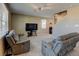 Comfortable living area boasts recliner seating, a large TV, and neutral tones, perfect for relaxation and entertainment at 5837 High Timber Cir, Castle Rock, CO 80104