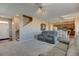 Open-concept living space with a neutral palette offers great flow between living, dining, and kitchen areas at 5837 High Timber Cir, Castle Rock, CO 80104
