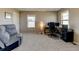 Office space with computer desk, comfortable seating, and large bright windows at 5837 High Timber Cir, Castle Rock, CO 80104