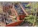 Aerial view shows the house roof, solar panels and a cozy backyard at 23626 Genesee Village Rd, Golden, CO 80401